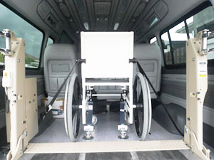 Accessible van with wheelchair clamped inside